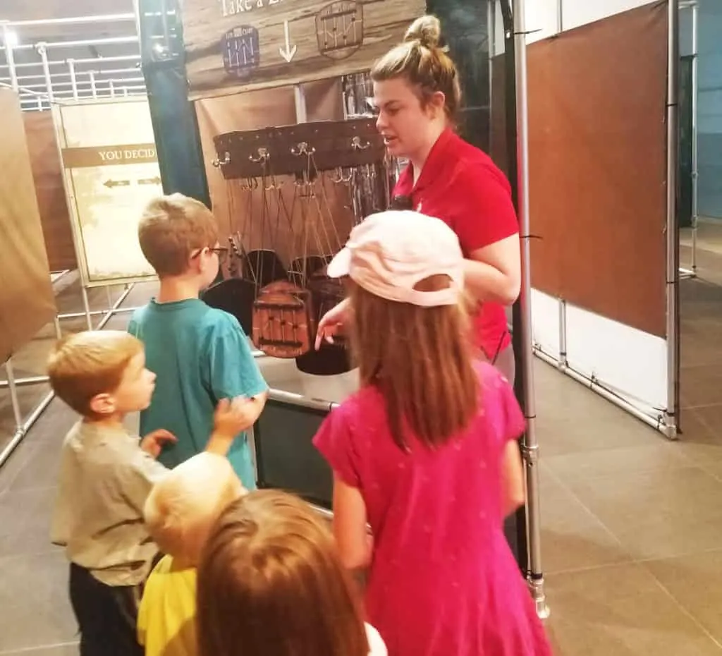 Thanksgiving Point American Adventure Maze 4 Museum of Natural Curiosity helper teaching us about the Adventure Maze at Thanksgiving Point