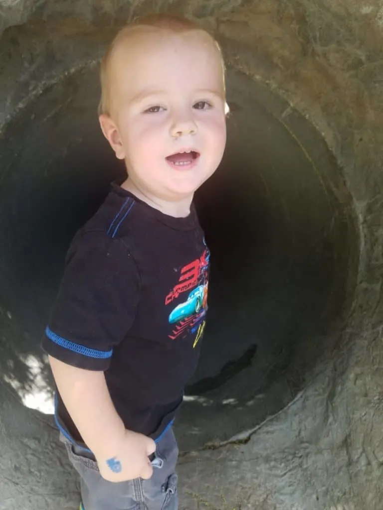 Educational Thanksgiving Point Activities and Events 8 Little boy in cave at Discovery Gardens at Thanksgiving Point in Lehi, UT