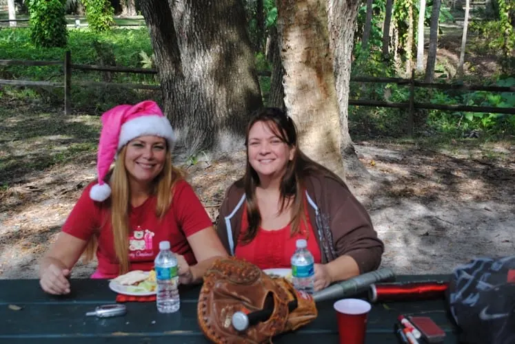 A Christ-Centered Christmas Eve Tradition: The Traveling Dinner 2 Two homeschooling moms at the park enjoying a Christ-centered Christmas Eve tradition of a traveling dinner.