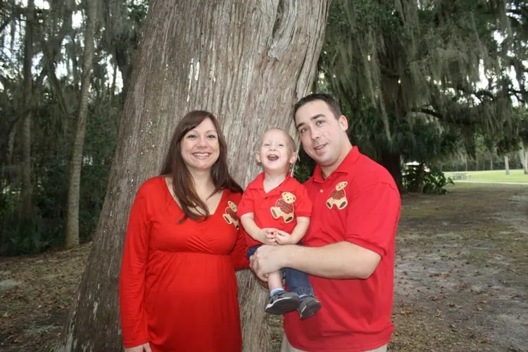 A Christ-Centered Christmas Eve Tradition: The Traveling Dinner 5 Homeschooling family dressed in red enjoying a Christ-centered Christmas Eve tradition of a traveling dinner.