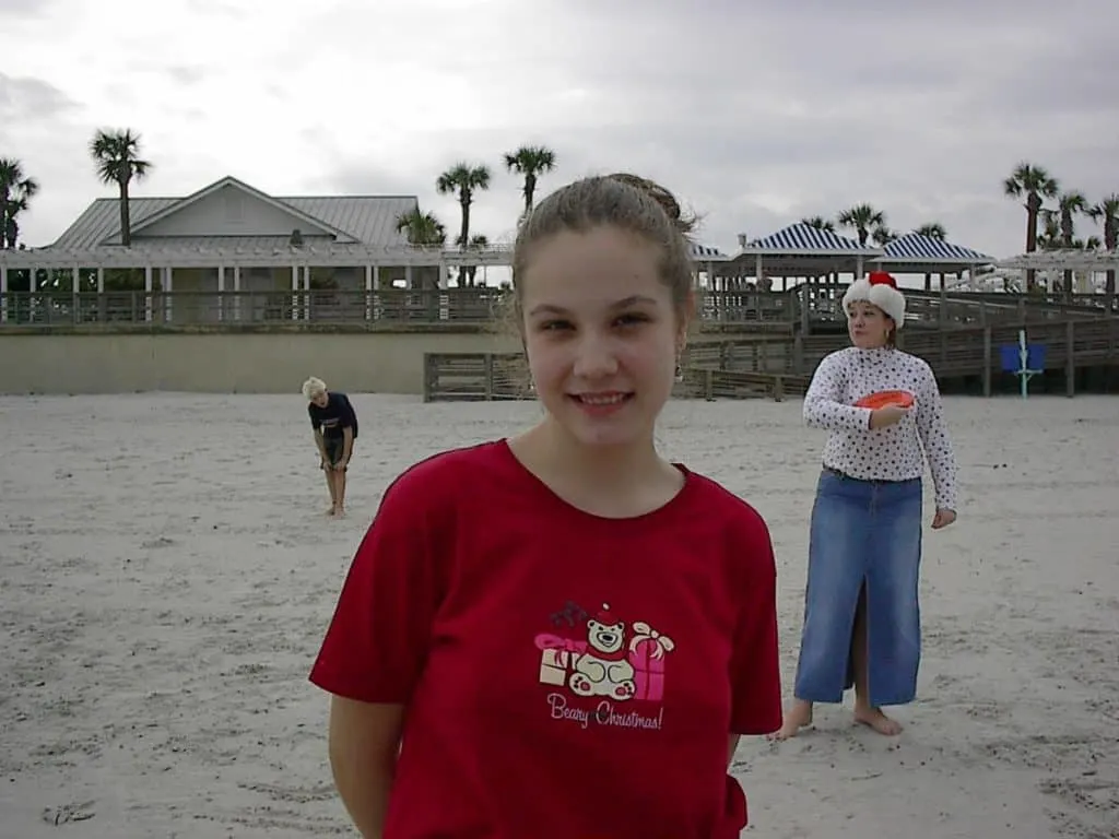 A Christ-Centered Christmas Eve Tradition: The Traveling Dinner 7 Homeschooled girl in red shirt enjoying a Christ-centered Christmas Eve tradition of a traveling dinner.