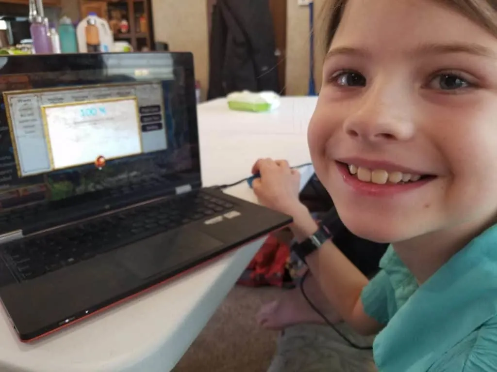 How to Enjoy Fun Vocabulary Games with Vocabulary Quest 6 Smiling homeschooled girl happy with a good vocabulary test score
