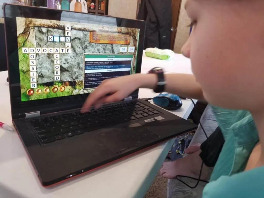 How to Enjoy Fun Vocabulary Games with Vocabulary Quest 4 Girl playing a fun vocabulary video game crossword puzzle