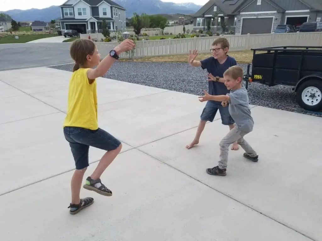 Giants, Wizards, Elves Outdoor Game Instructions 2 Kids playing the outdoor group game giants wizards elves