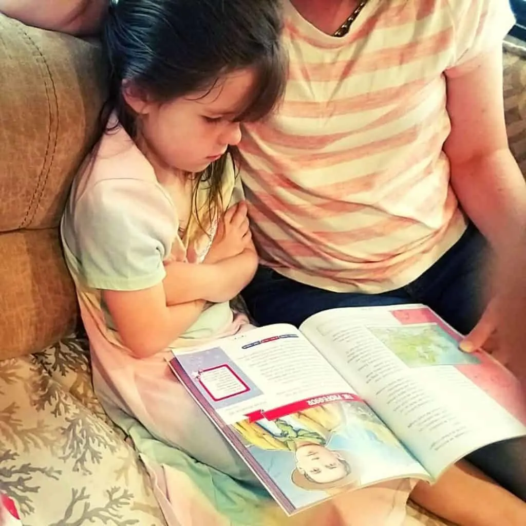Christian Homeschool Program That's Easy To Love 5 little girl and her mom reading a Christian American history book