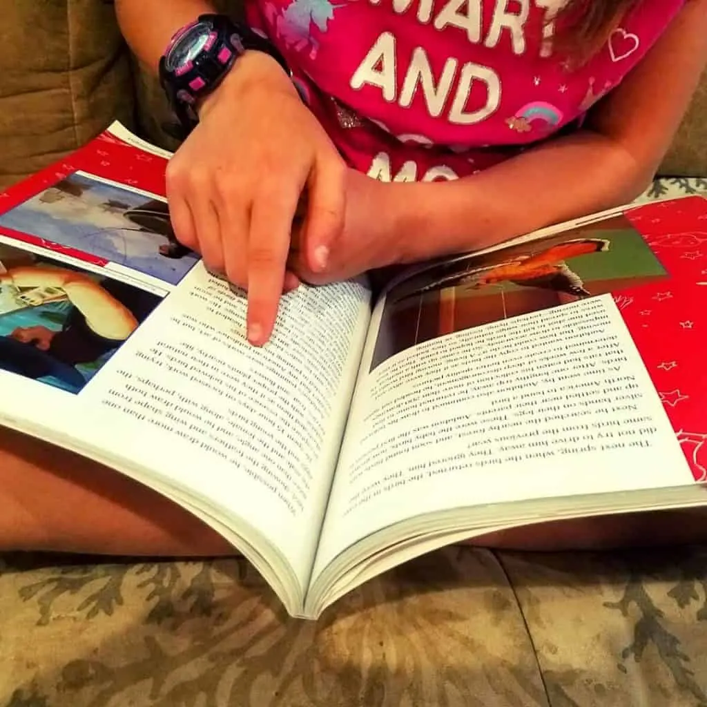Christian Homeschool Program That's Easy To Love 6 little girl reading a childrens book that teaches american history