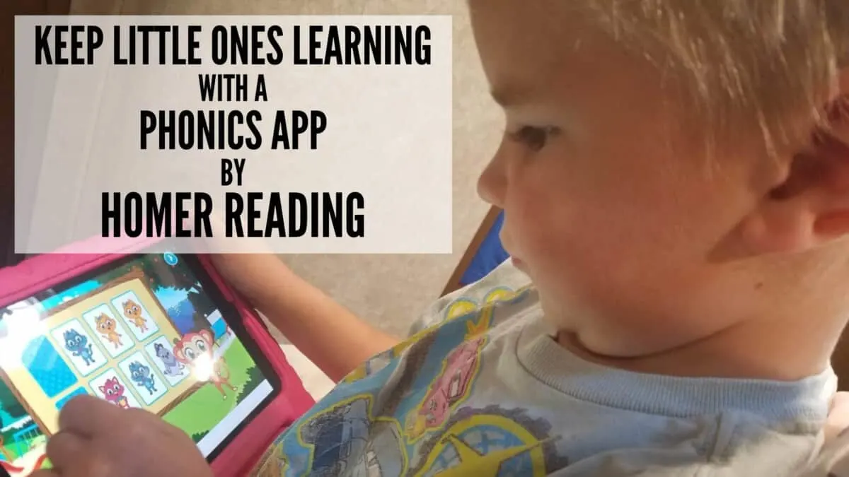 little boy distracted by a phonics learn to read app by HOMER while his bigger siblings do homeschool