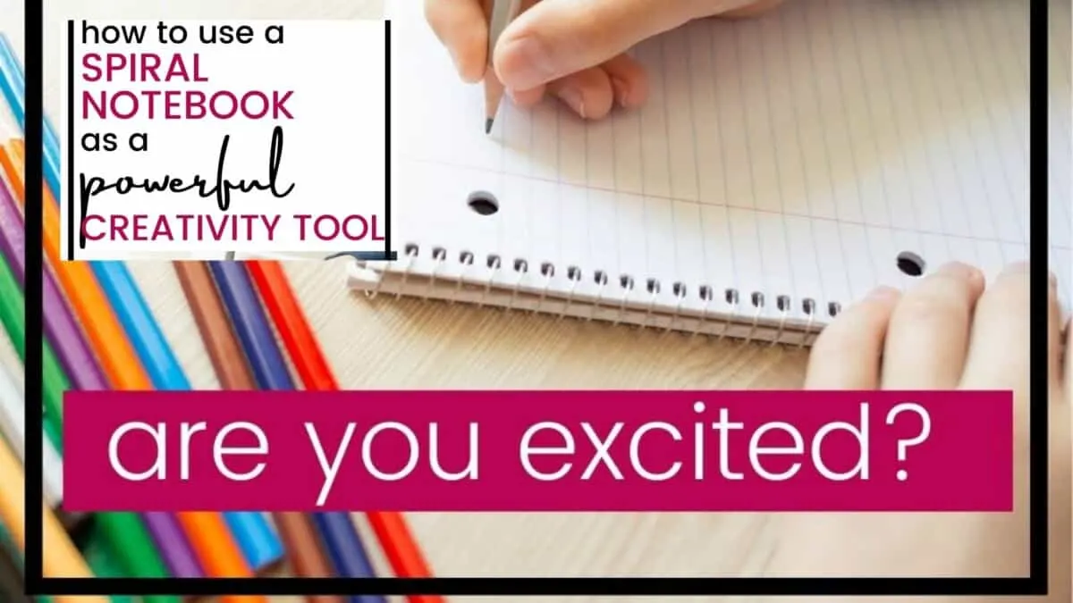 child's hand writing in a spiral notebook creativity tool with a pile of colored pencils nearby