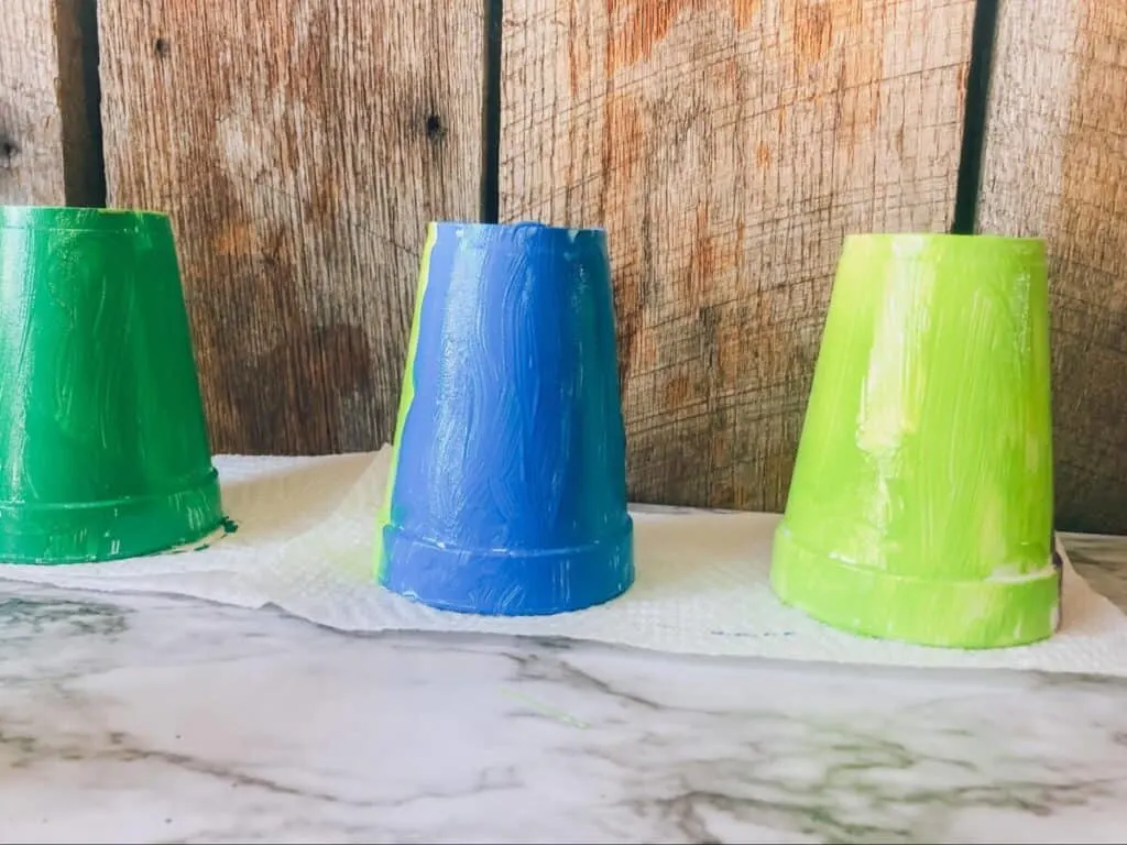 Gratifying Smoking Dragon STEM Activity for Kids 3 styrofoam cups being painted for a smoking dragon stem activity