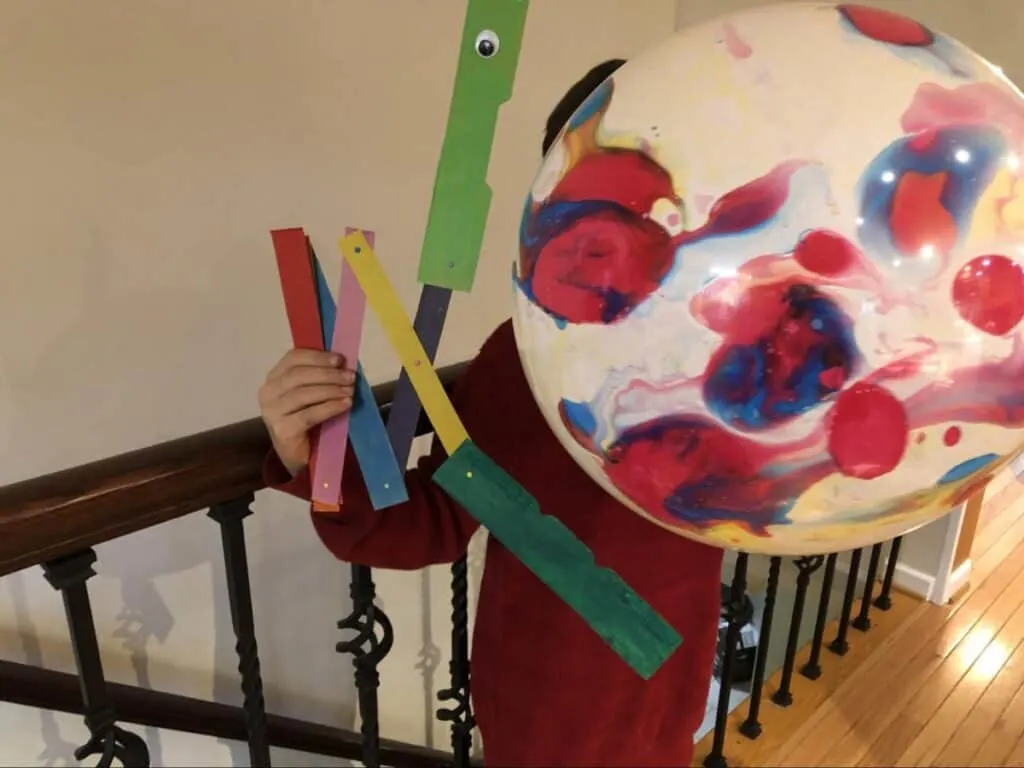 Chomping Cardboard Dragon STEAM Craft for Kids 13 chomping cardboard dragon eating a big rubber ball