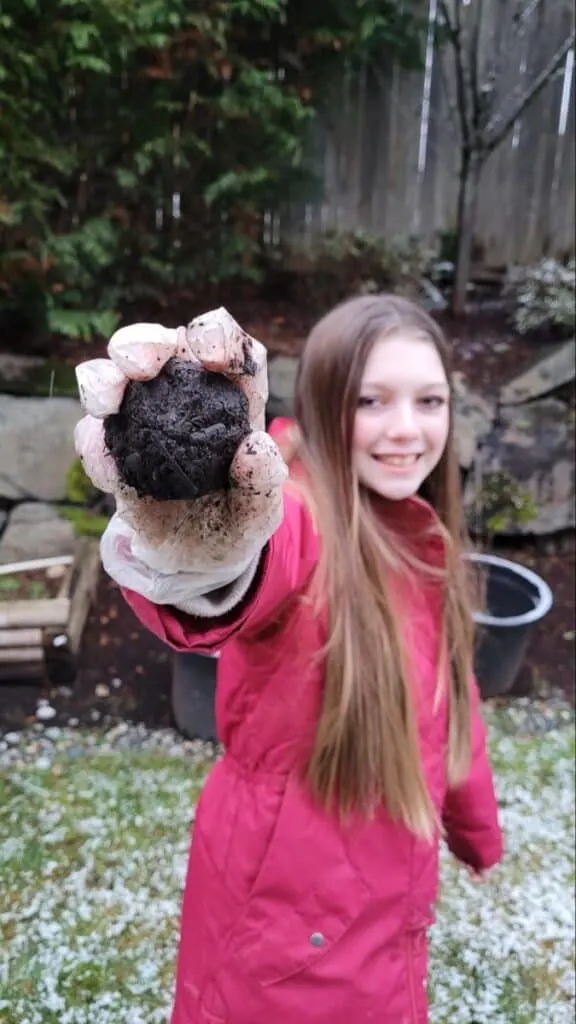 11 Cheap Mother's Day Gift Ideas 9 little girl holding her homemade seed bomb