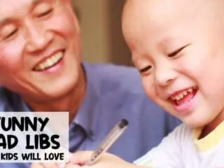 dad and son laughing at some funny mad libs printables