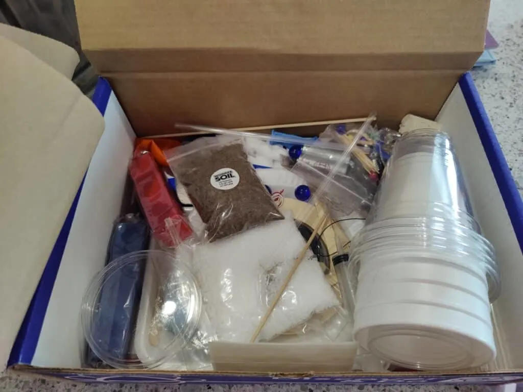 BookShark | A Science Curriculum with Engaging, Hands-on Experiments 6 Open box of BookShark Science kit filled with materials needed for hands-on science projects and experiments