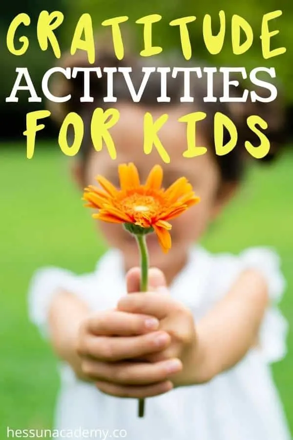 16+ Gratitude Activities For Kids That Are Fun And Engaging 18 little girl with a yellow flower enjoying some gratitude activities for kids