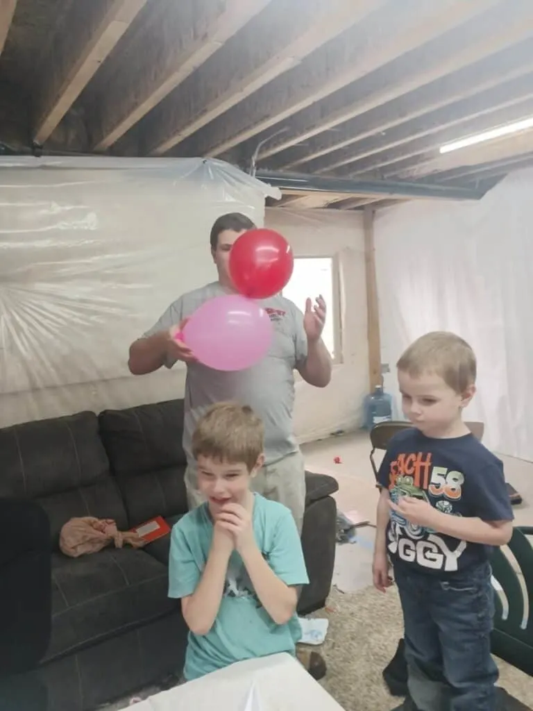 Static Electricity Experiment for Kids - Tame a Dragon with Magic 7 man and kids experimenting with static electricity using two balloons