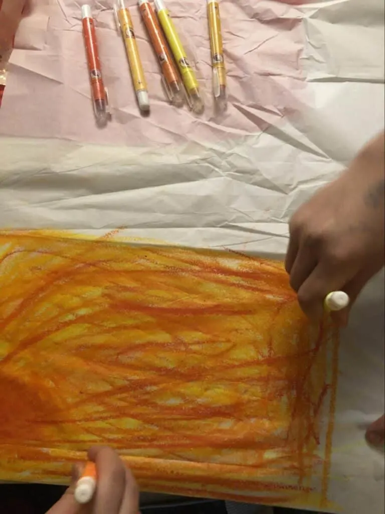 Paper Mache Dragon STEM and Craft Project Tutorial 17 coloring tissue paper red and yellow for paper mache dragon fire