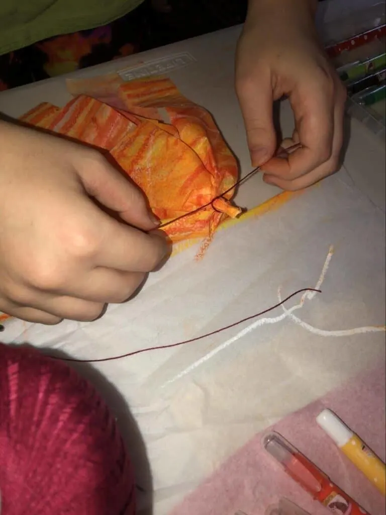 Paper Mache Dragon STEM and Craft Project Tutorial 18 making fire for paper mache dragon out of orange tissue paper