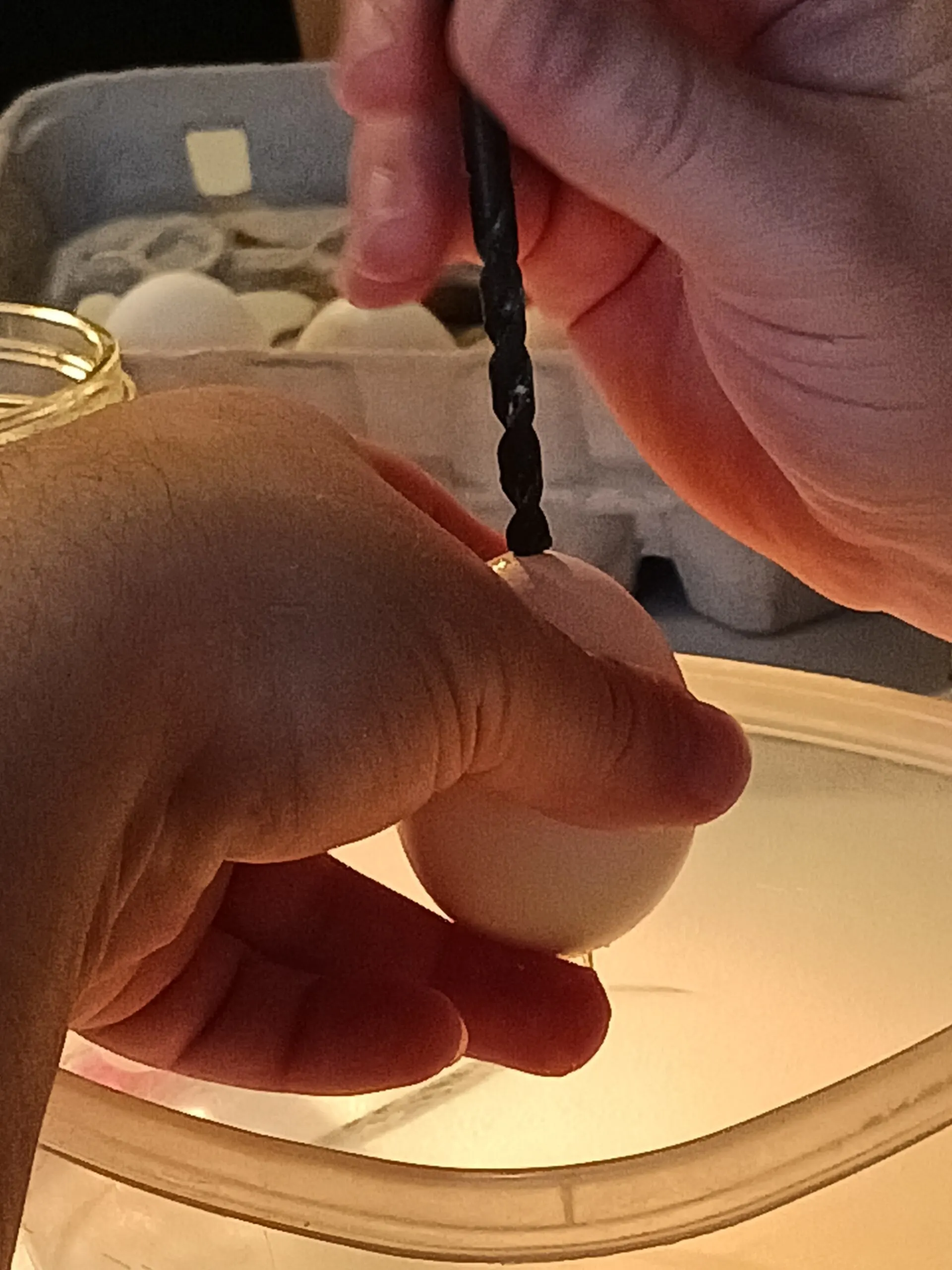 DIY Crystal Egg Geodes STEM Project (Dragon Eggs) 3 drilling a hole in an egg for egg blowing