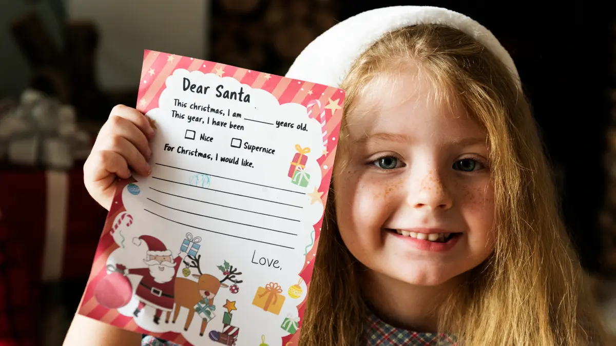 words-of-affirmation-learning (2) Child holding a worksheet with encouraging feedback written on it.